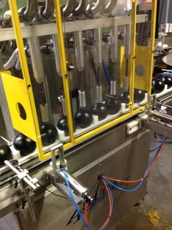 Hollow plastic shade balls on the production line at XavierC LLC manufacturing facility.